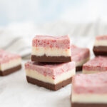 A stack of neapolitan fudge squares.