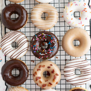 Aerial view of homemade donuts on a wire cooling wrack.