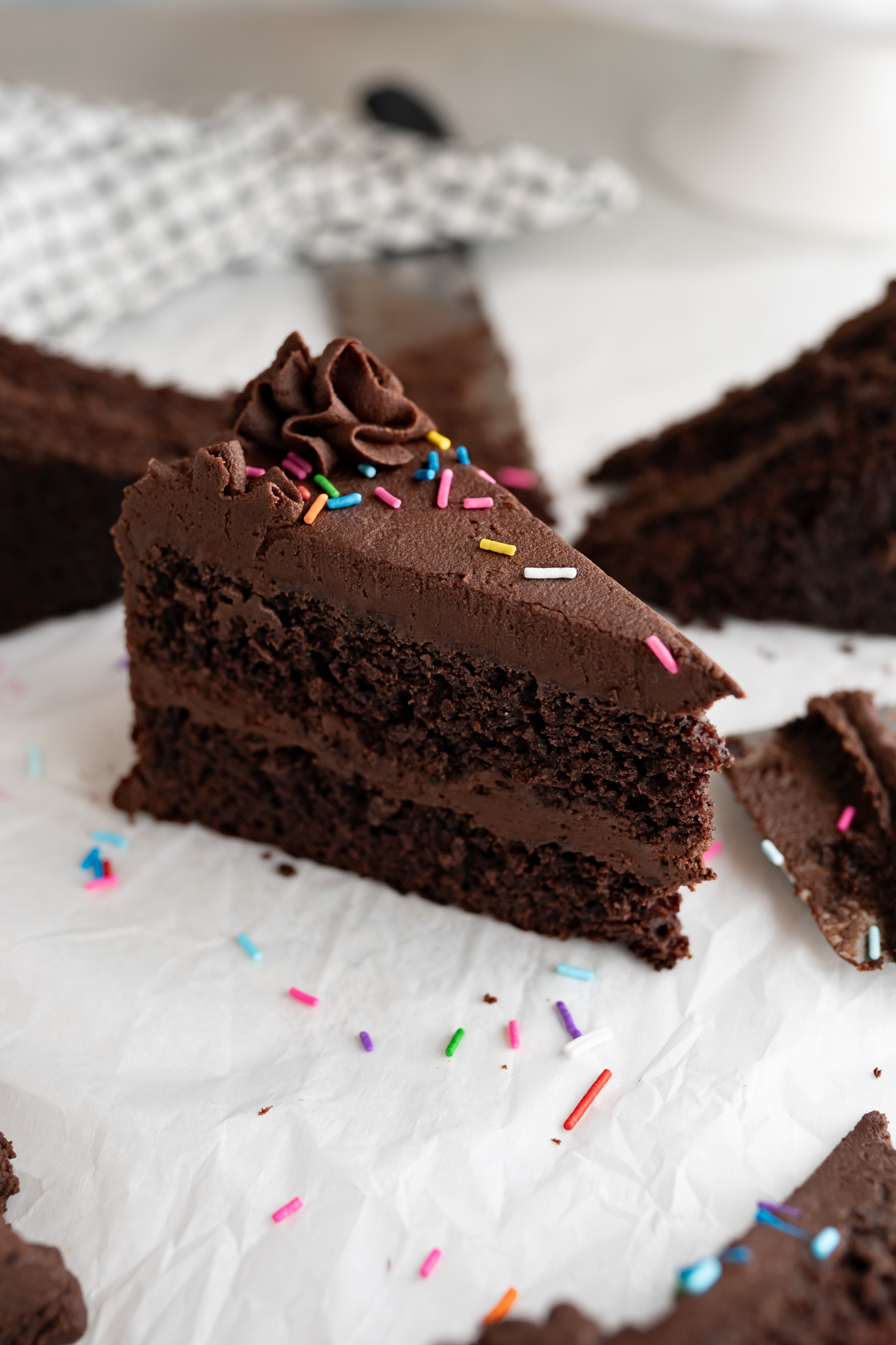 A slice of layered chocolate cake. 