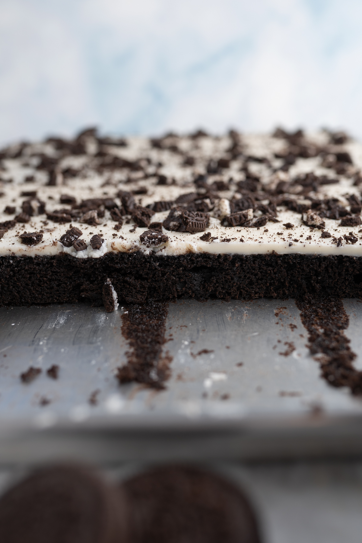 Side view of a pan of Oreo Texas Sheet Cake.