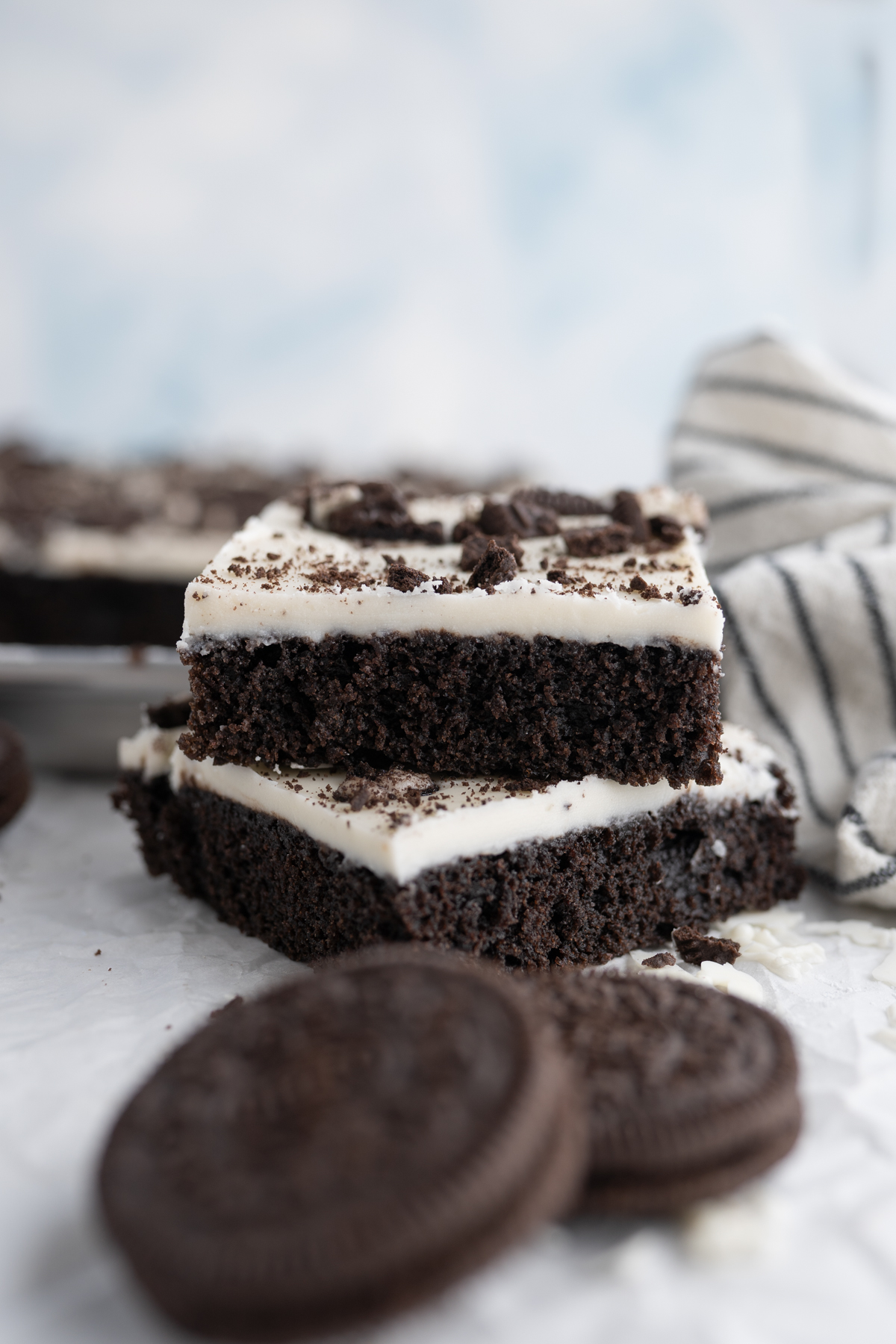 A stack of two slices of Oreo texas sheet cake.