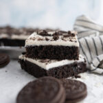 Two slices of Oreo Texas Sheet Cake stacked.