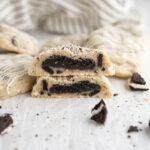 Oreo truffle filled cookies n' cream cookie cut in half to reveal the truffle.