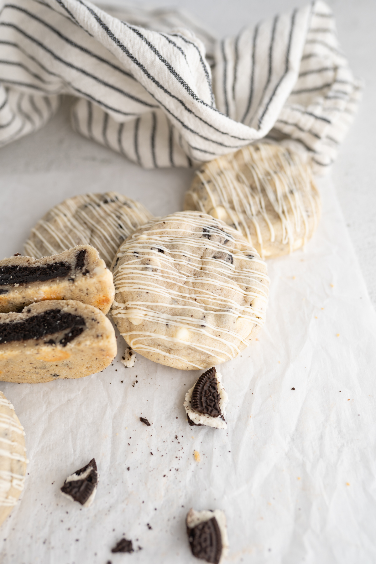 A counter filled with white chocolate oreo cookies with an oreo truffle filling. 