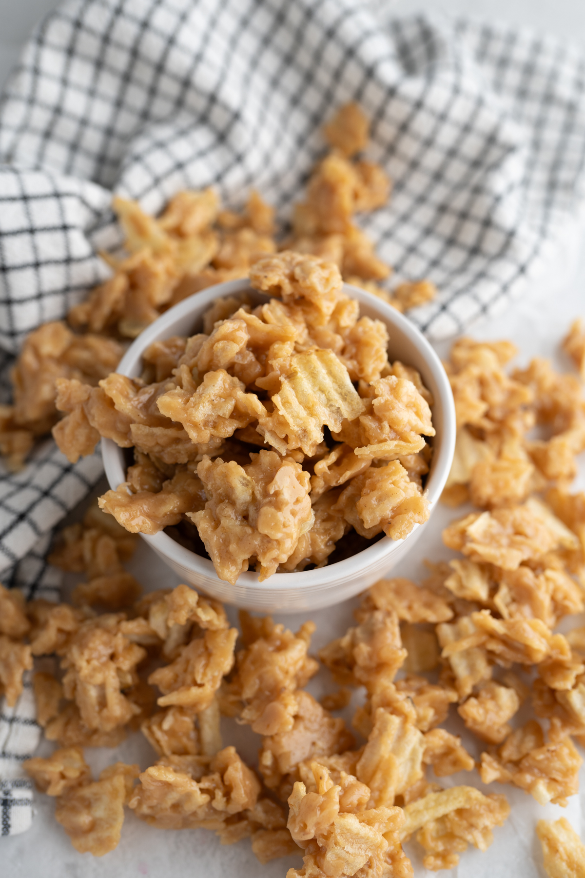 A bowl of no bake peanut butter potato chip candy. 