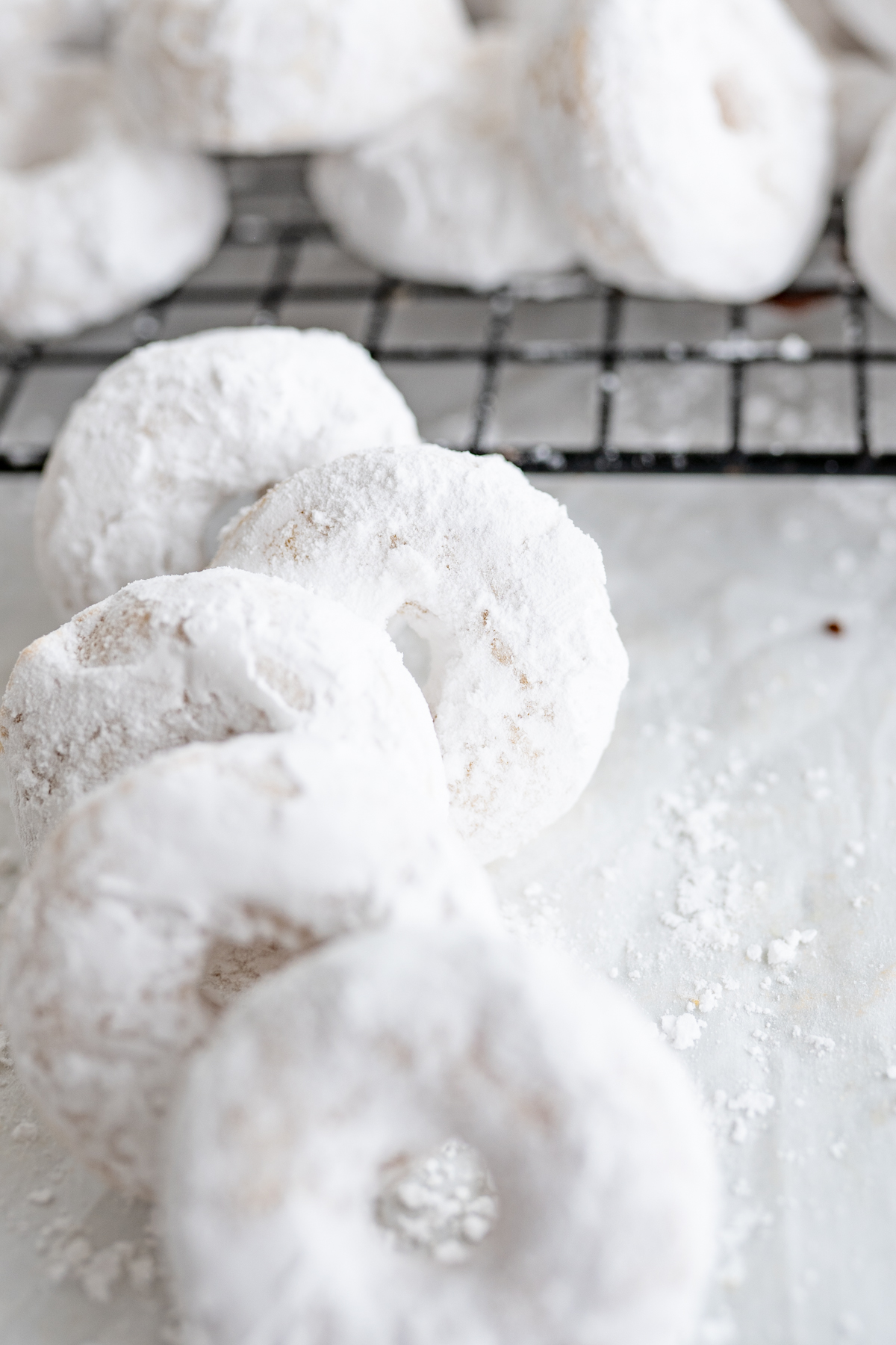 A stack of powdered mini donuts. 