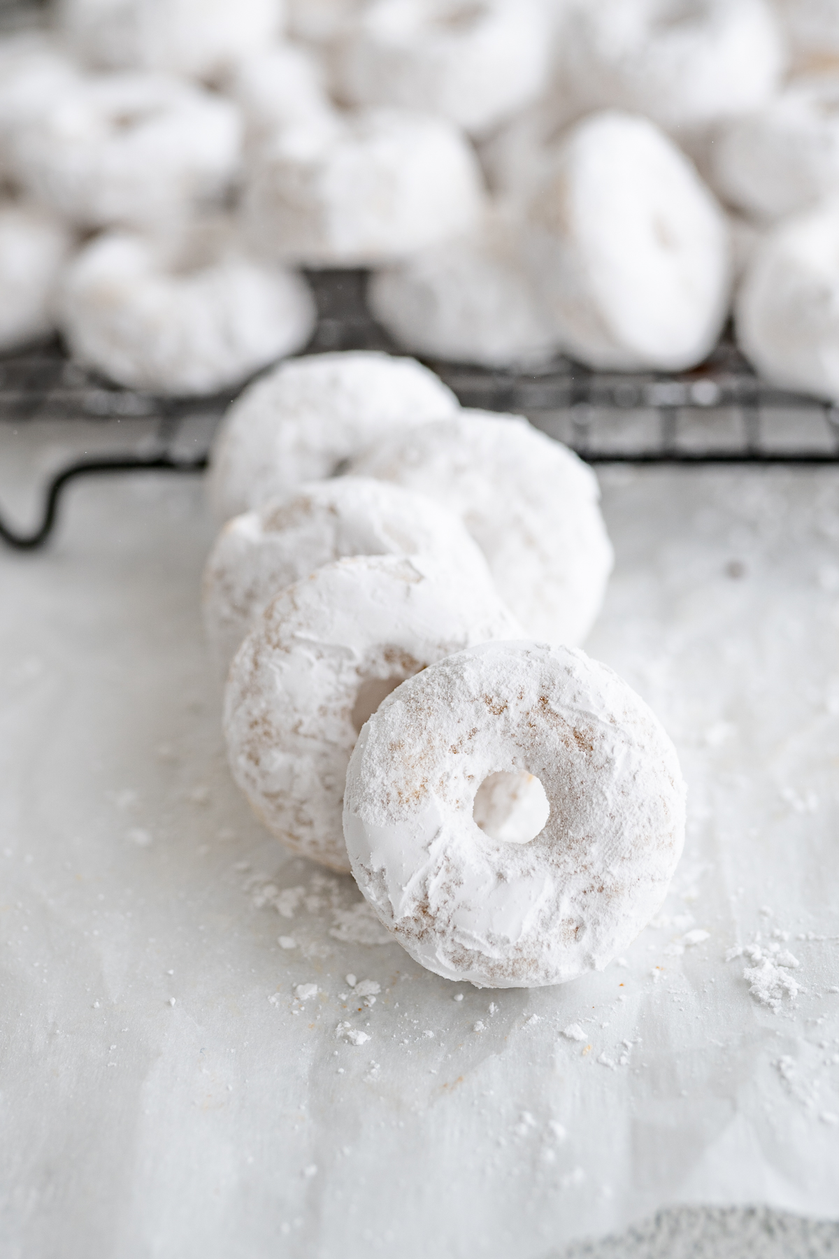 Side view of powdered sugar donuts made from scratch. 